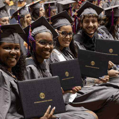 Commencement 2025 Students with their diplomas